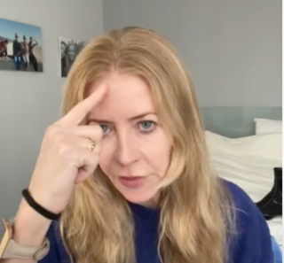 Alice pointing to her forehead