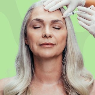 Older woman with grey hair getting botox